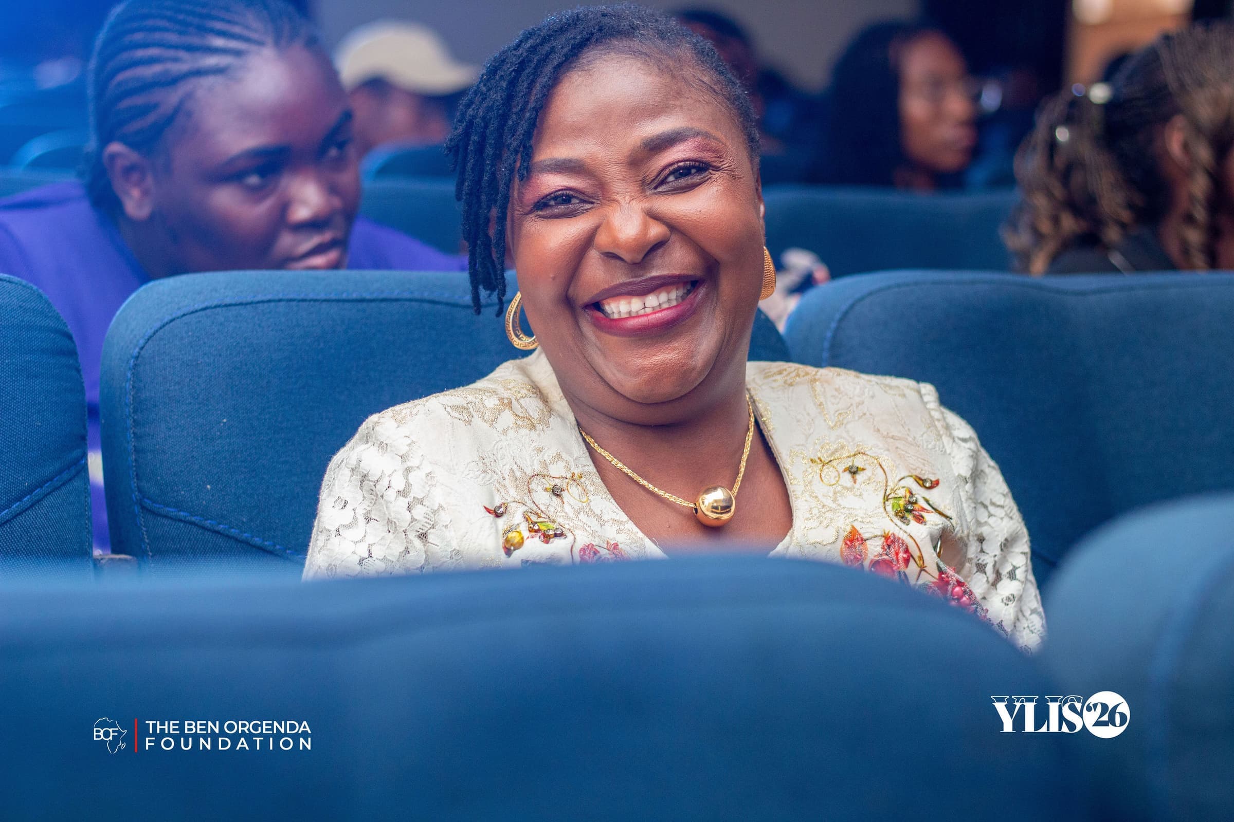 A woman smiling in the audience