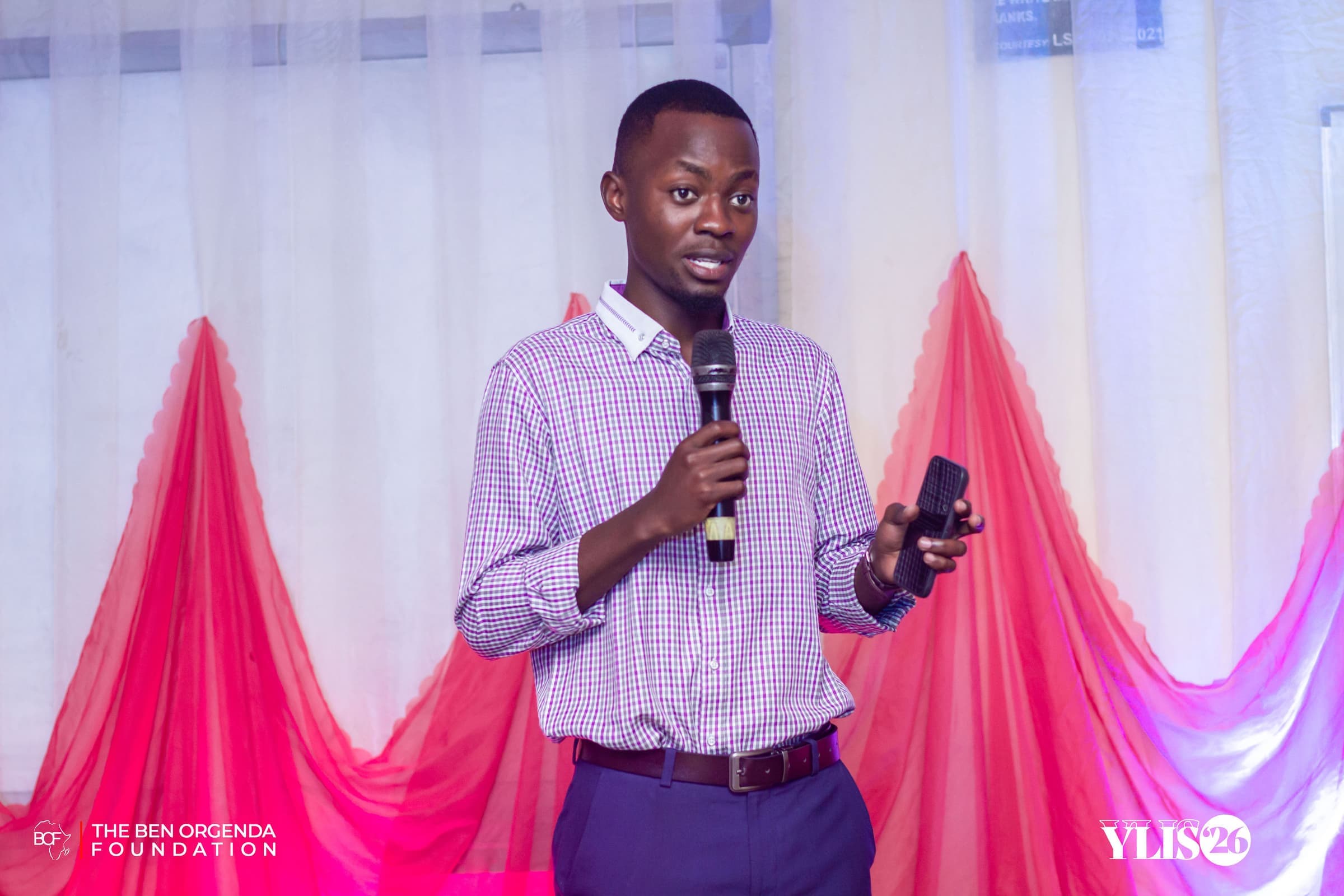 A young participant speaking into a microphone